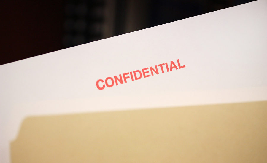 Confidential document labeled in red ink