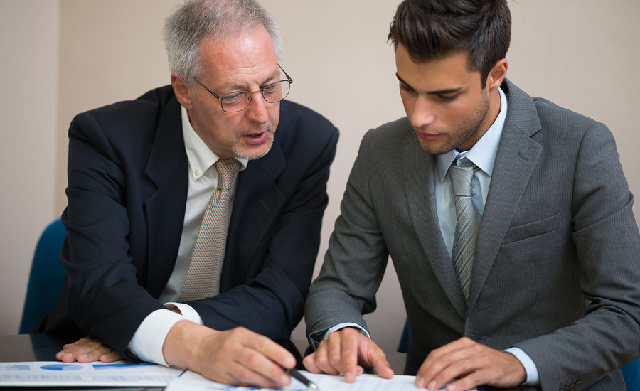 Two business professionals reviewing documents together.