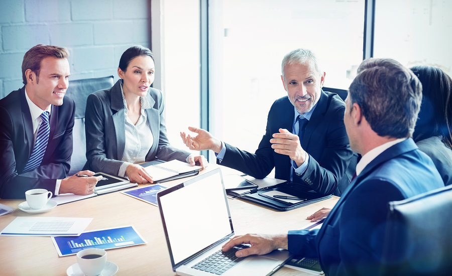 Business professionals having a meeting in a conference room.