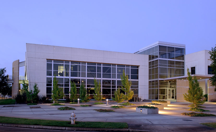 Modern office building illuminated in the evening.