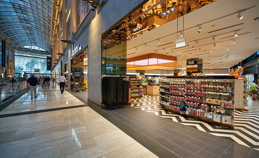 Modern grocery store entrance with colorful displays and contemporary design